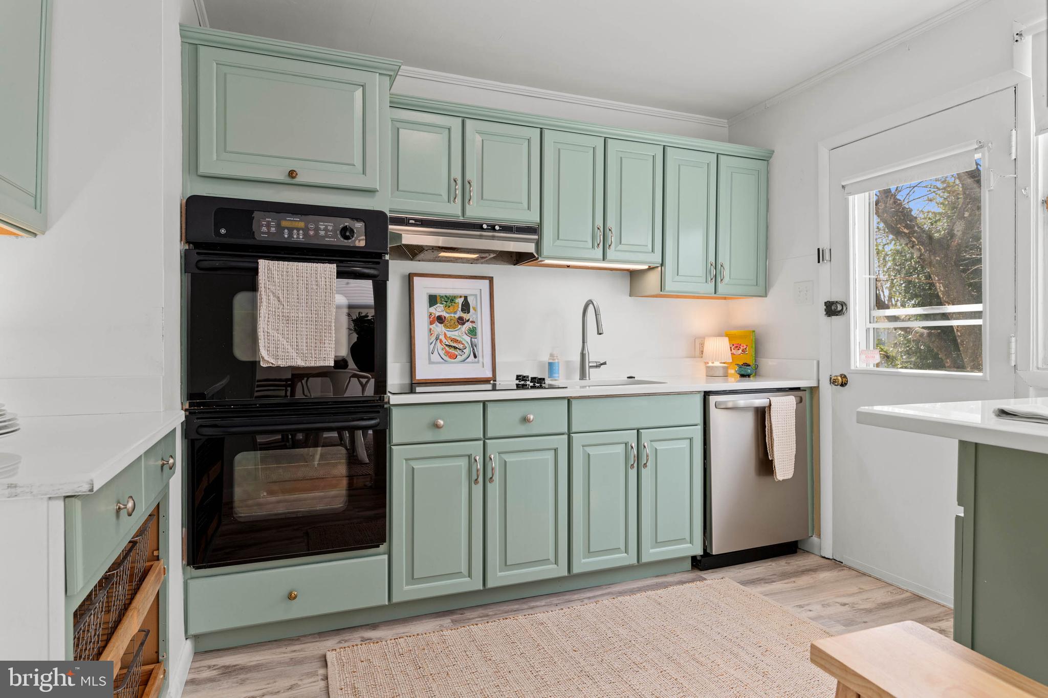627 Wayland Road Plymouth Meeting, PA 19462 - Photo 11 of 40 a kitchen with stainless steel appliances granite countertop a stove a sink and a microwave