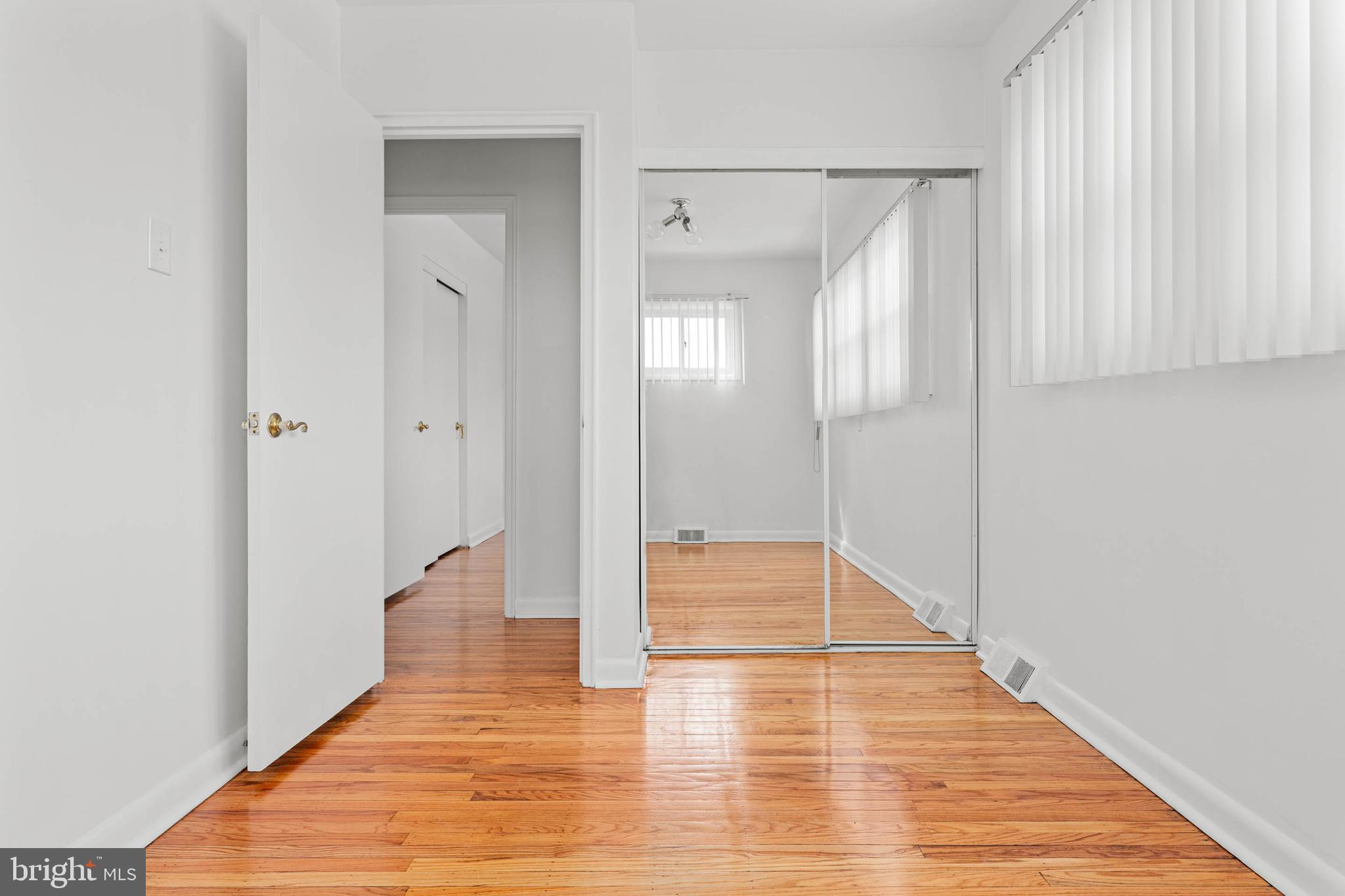 627 Wayland Road Plymouth Meeting, PA 19462 - Photo 22 of 40 a view of a hallway with wooden floor and staircase
