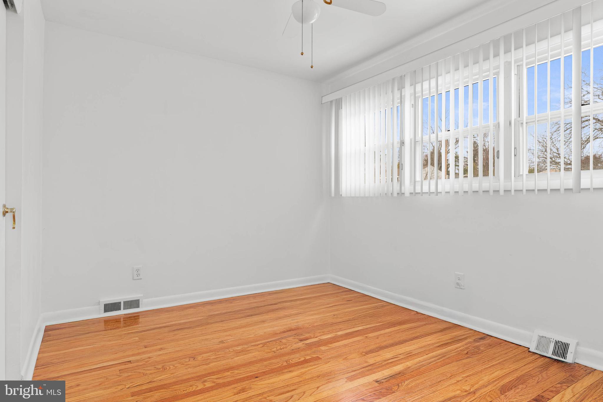 627 Wayland Road Plymouth Meeting, PA 19462 - Photo 23 of 40 a view of wooden floor and windows in a room
