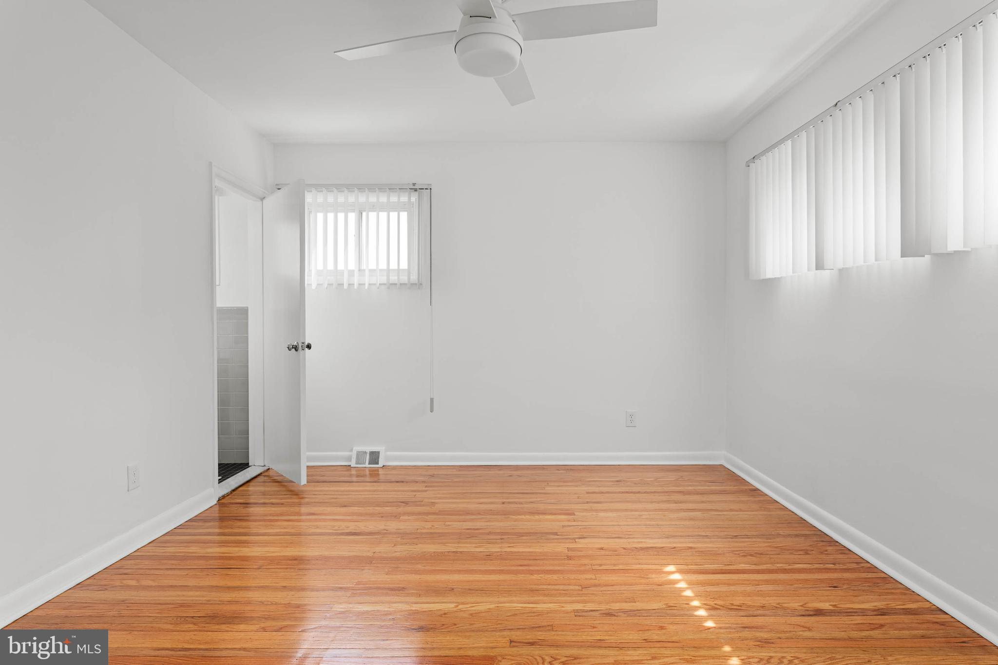 627 Wayland Road Plymouth Meeting, PA 19462 - Photo 27 of 40 wooden floor in an empty room with a window