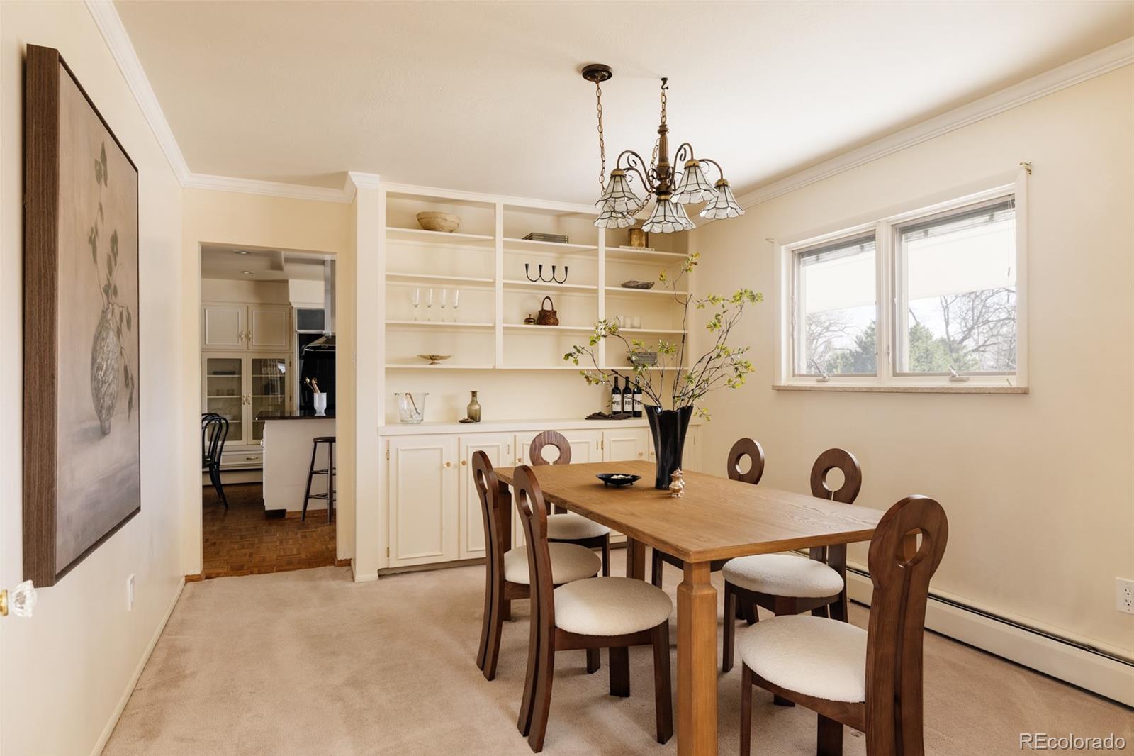 3095 Crabapple Road Golden, CO 80401 - Photo 14 of 50 a view of a dining room with furniture and a chandelier