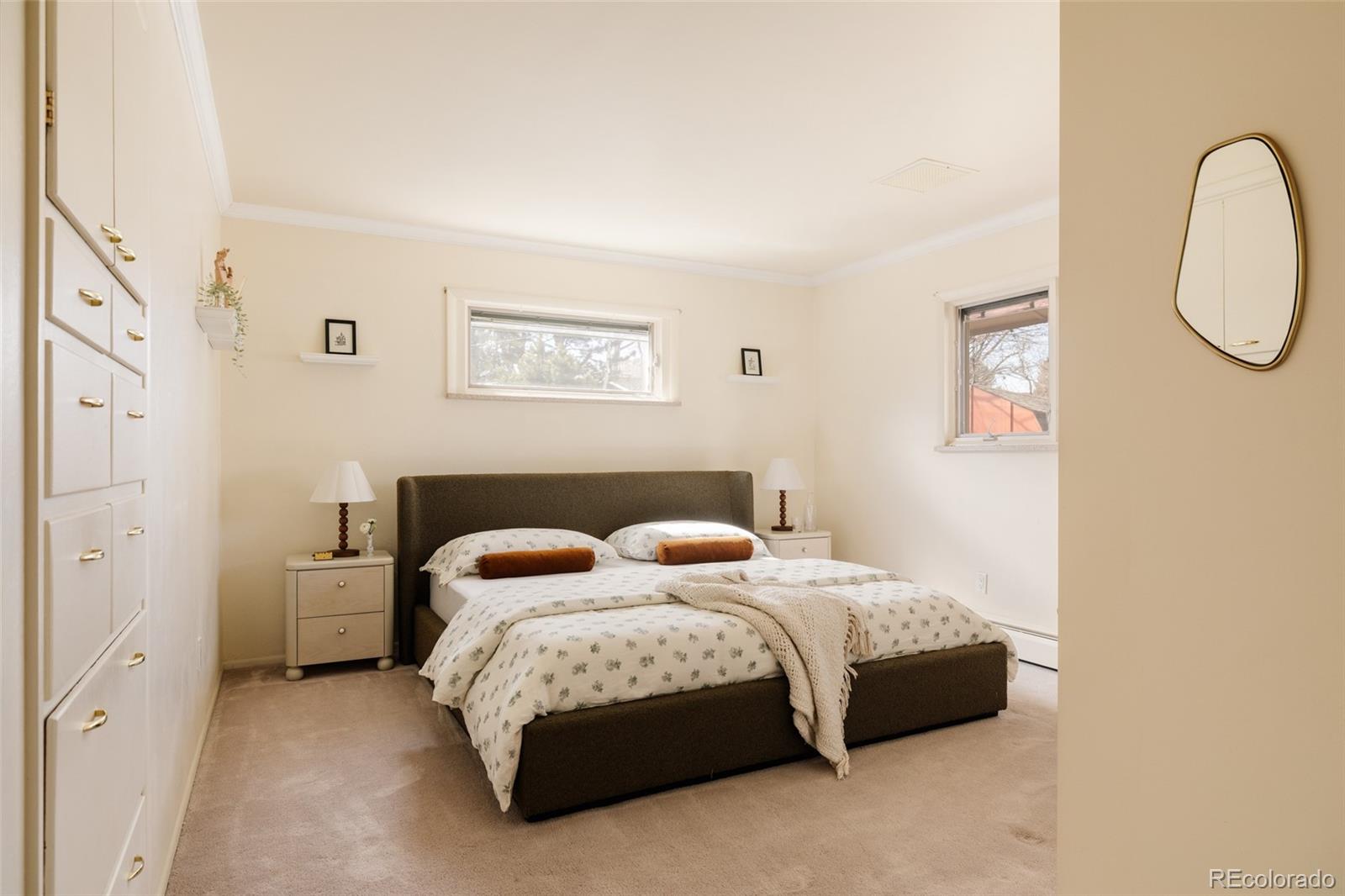 3095 Crabapple Road Golden, CO 80401 - Photo 22 of 50 a bedroom with a bed and a painting on the wall