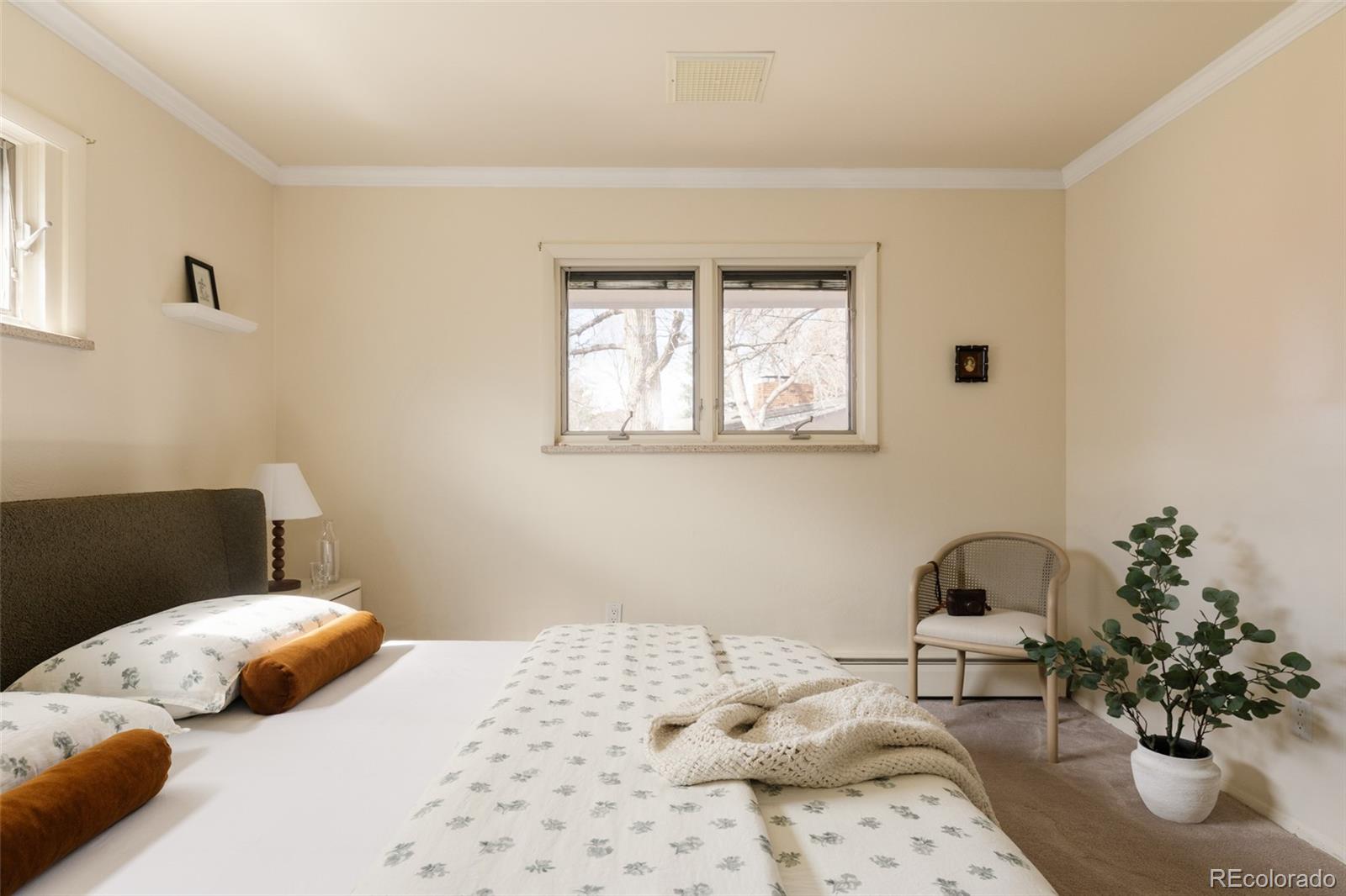 3095 Crabapple Road Golden, CO 80401 - Photo 23 of 50 a bedroom with a bed and a couch