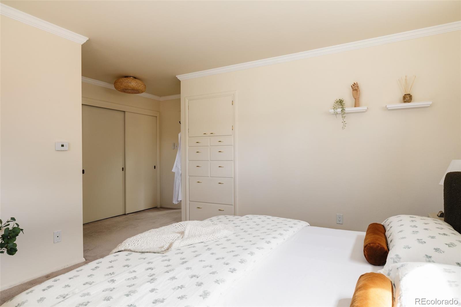 3095 Crabapple Road Golden, CO 80401 - Photo 24 of 50 a bedroom with a bed and wooden floor