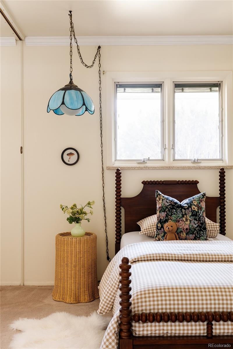 3095 Crabapple Road Golden, CO 80401 - Photo 34 of 50 a bedroom with a bed and window