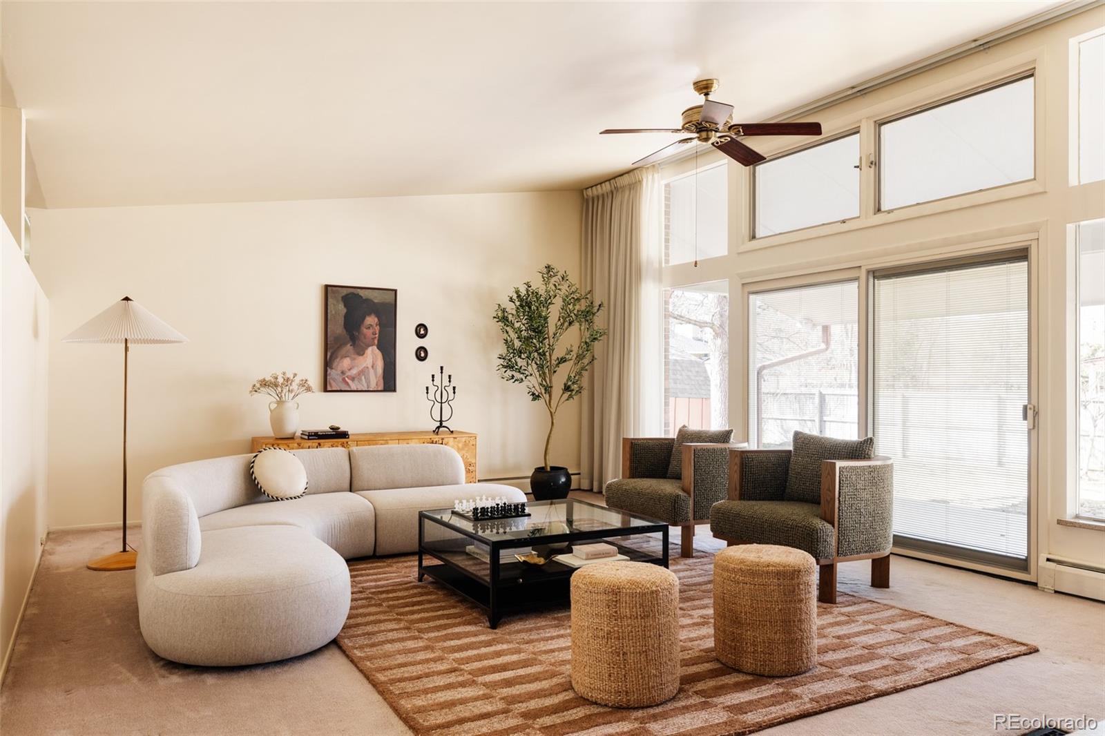 3095 Crabapple Road Golden, CO 80401 - Photo 5 of 50 a living room with furniture a large window and a chandelier