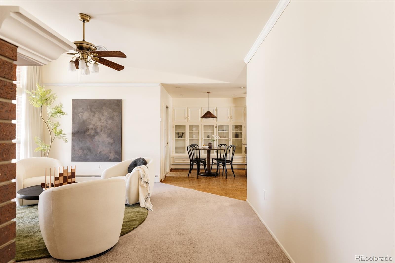 3095 Crabapple Road Golden, CO 80401 - Photo 10 of 50 a living room with furniture and a chandelier