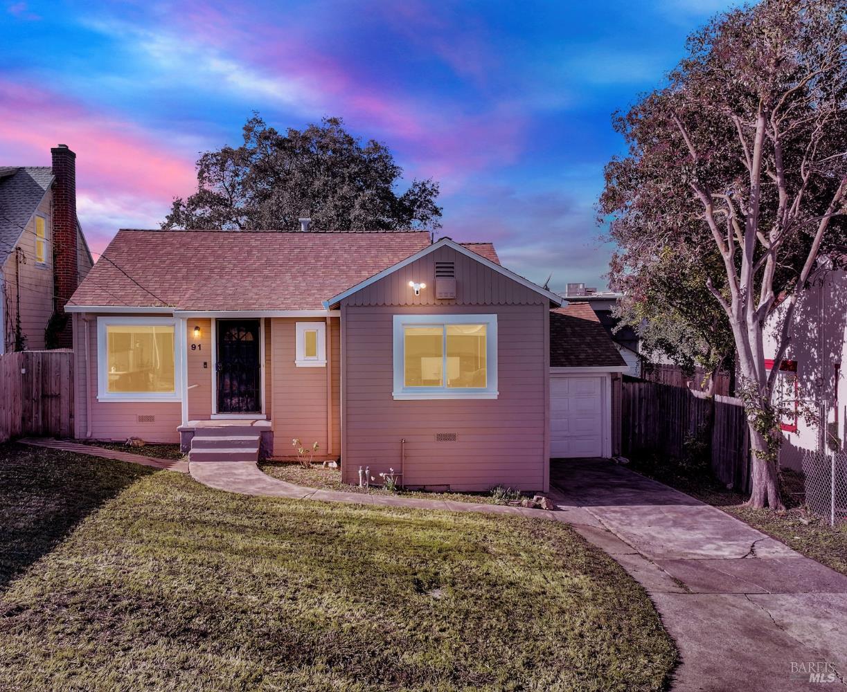 a view of a house with a yard