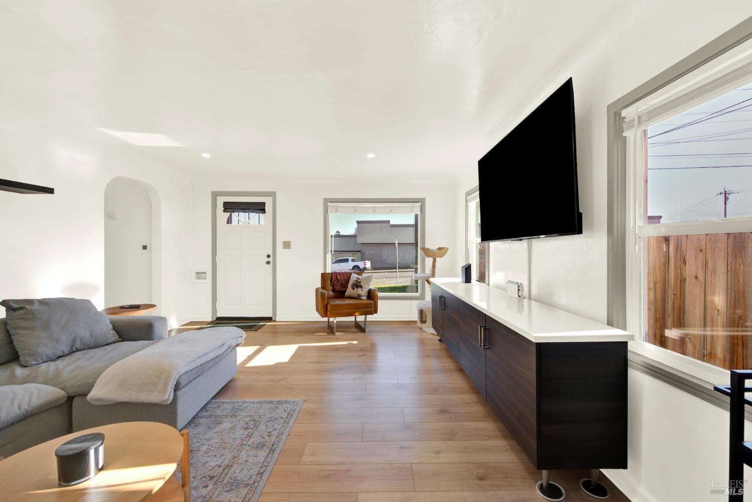 91 14th Street Vallejo, CA 94590 - Photo 11 of 48 a living room with furniture flat screen tv and a couch