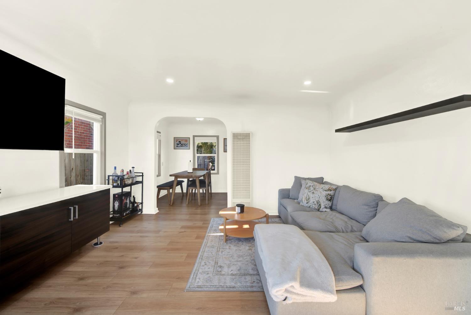 91 14th Street Vallejo, CA 94590 - Photo 13 of 48 a living room with furniture and a flat screen tv