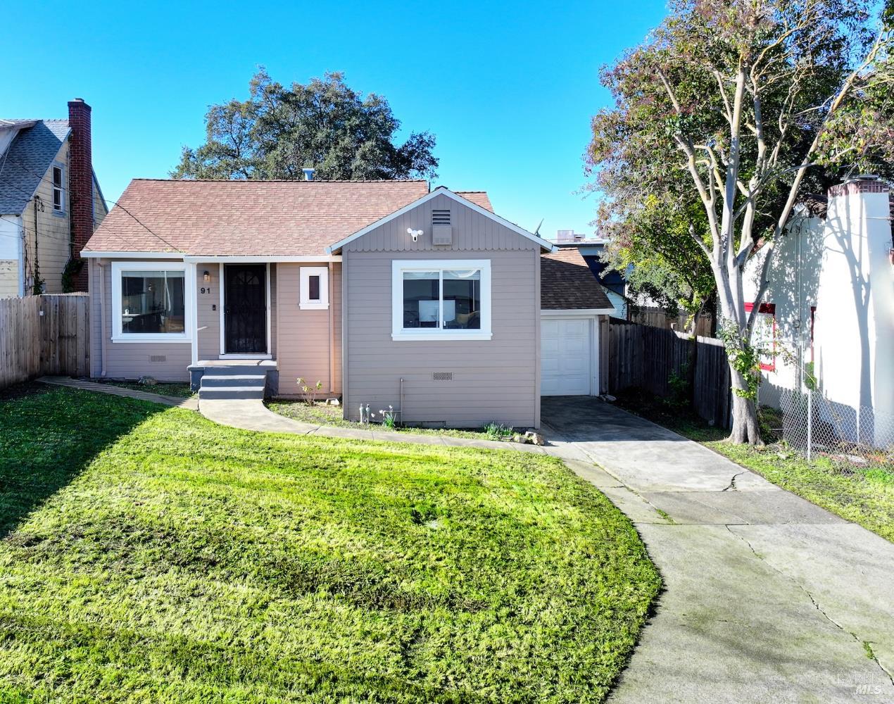 91 14th Street Vallejo, CA 94590 - Photo 2 of 48 a front view of a house with garden