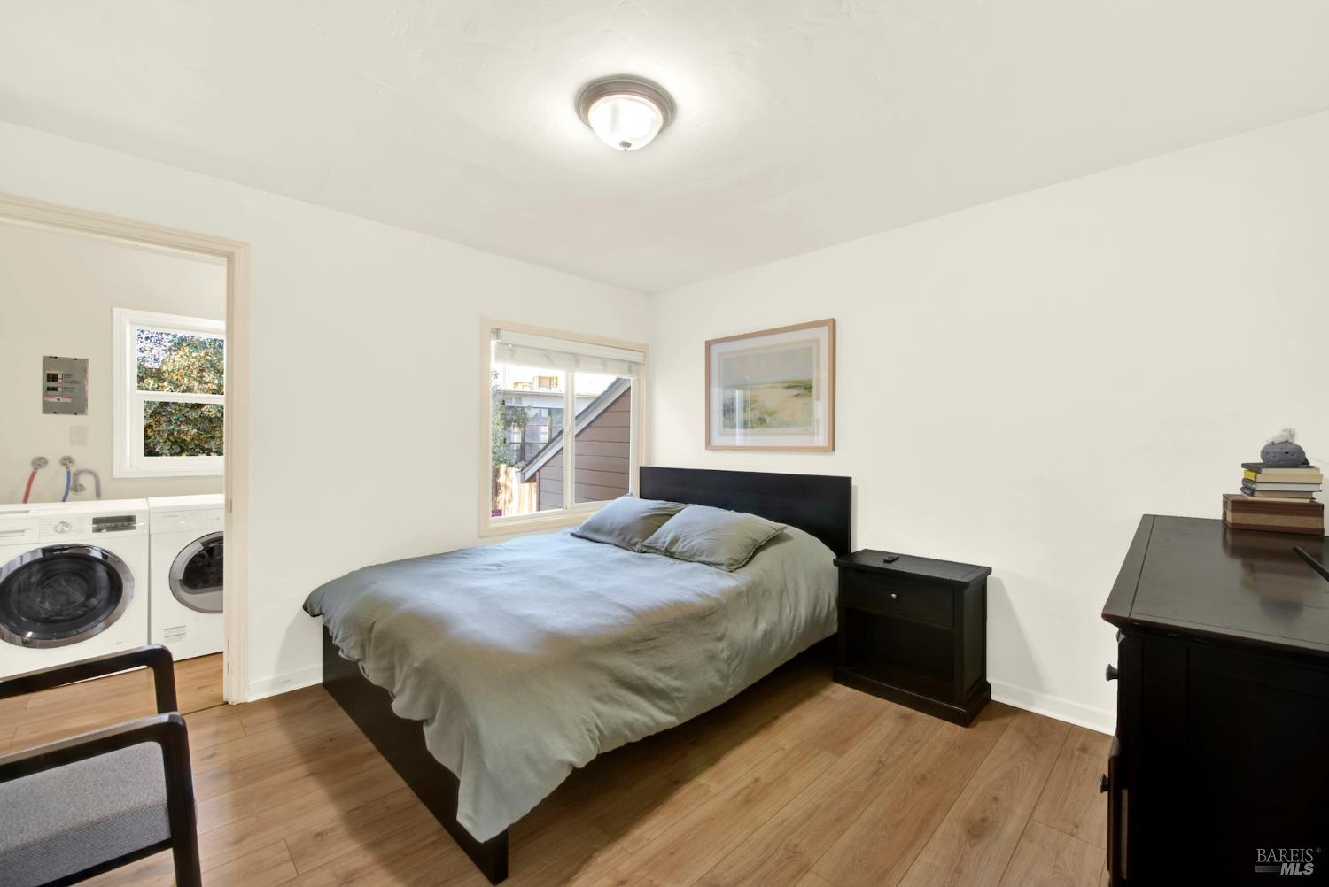 91 14th Street Vallejo, CA 94590 - Photo 28 of 48 a bedroom with a bed and a table in it