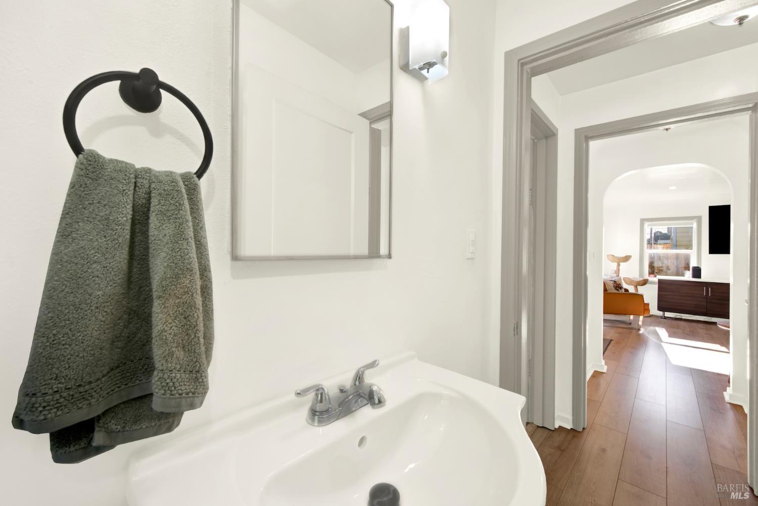 91 14th Street Vallejo, CA 94590 - Photo 32 of 48 a bathroom with a sink and a mirror