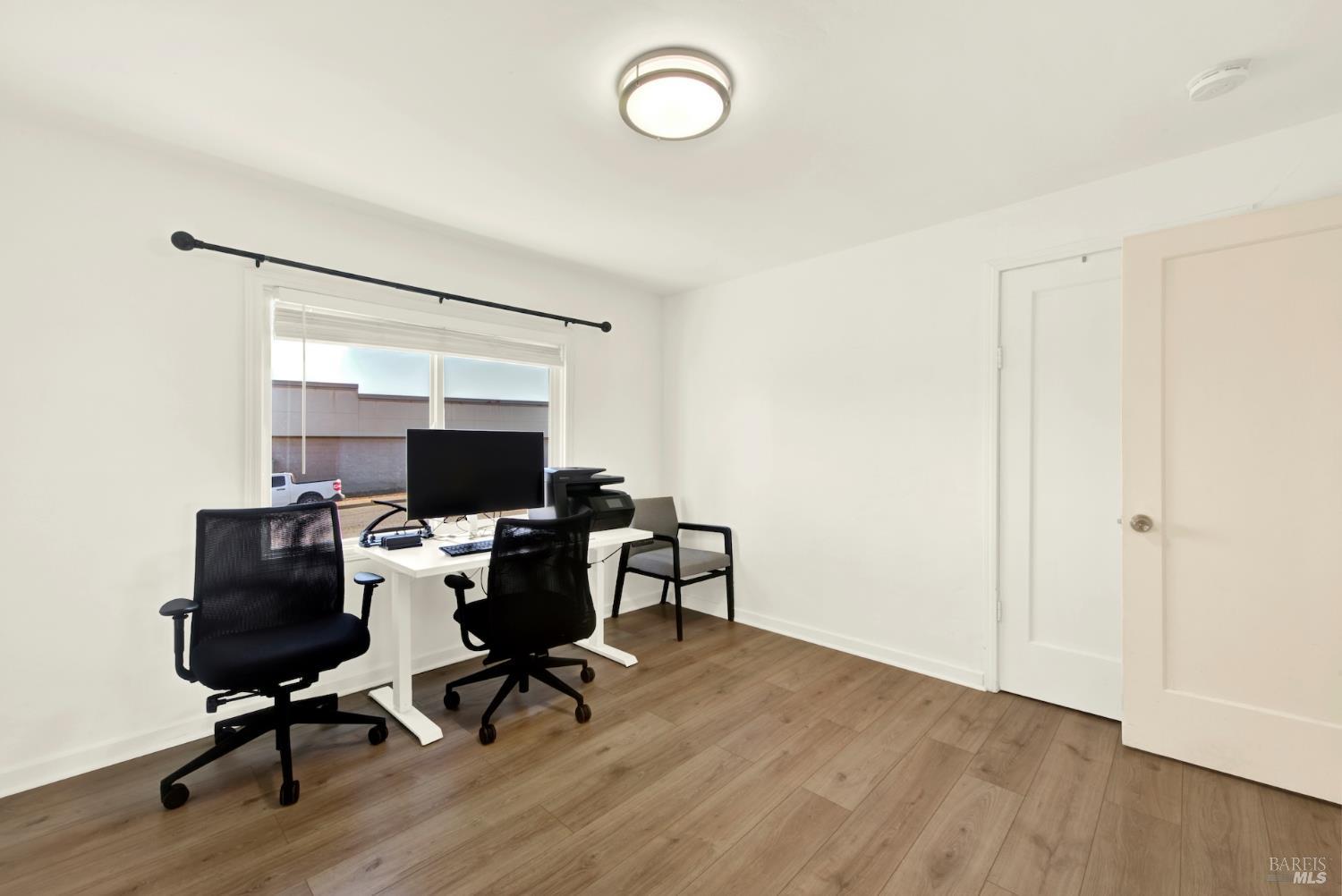 91 14th Street Vallejo, CA 94590 - Photo 34 of 48 a view of a workspace with furniture and a window