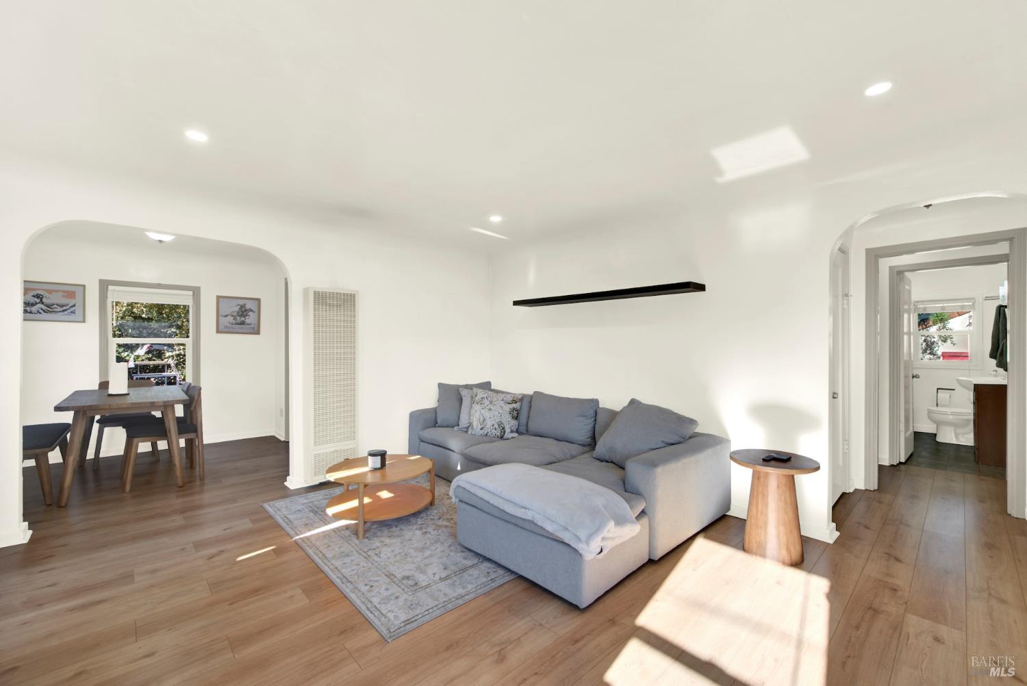 91 14th Street Vallejo, CA 94590 - Photo 9 of 48 a living room with furniture and a wooden floor