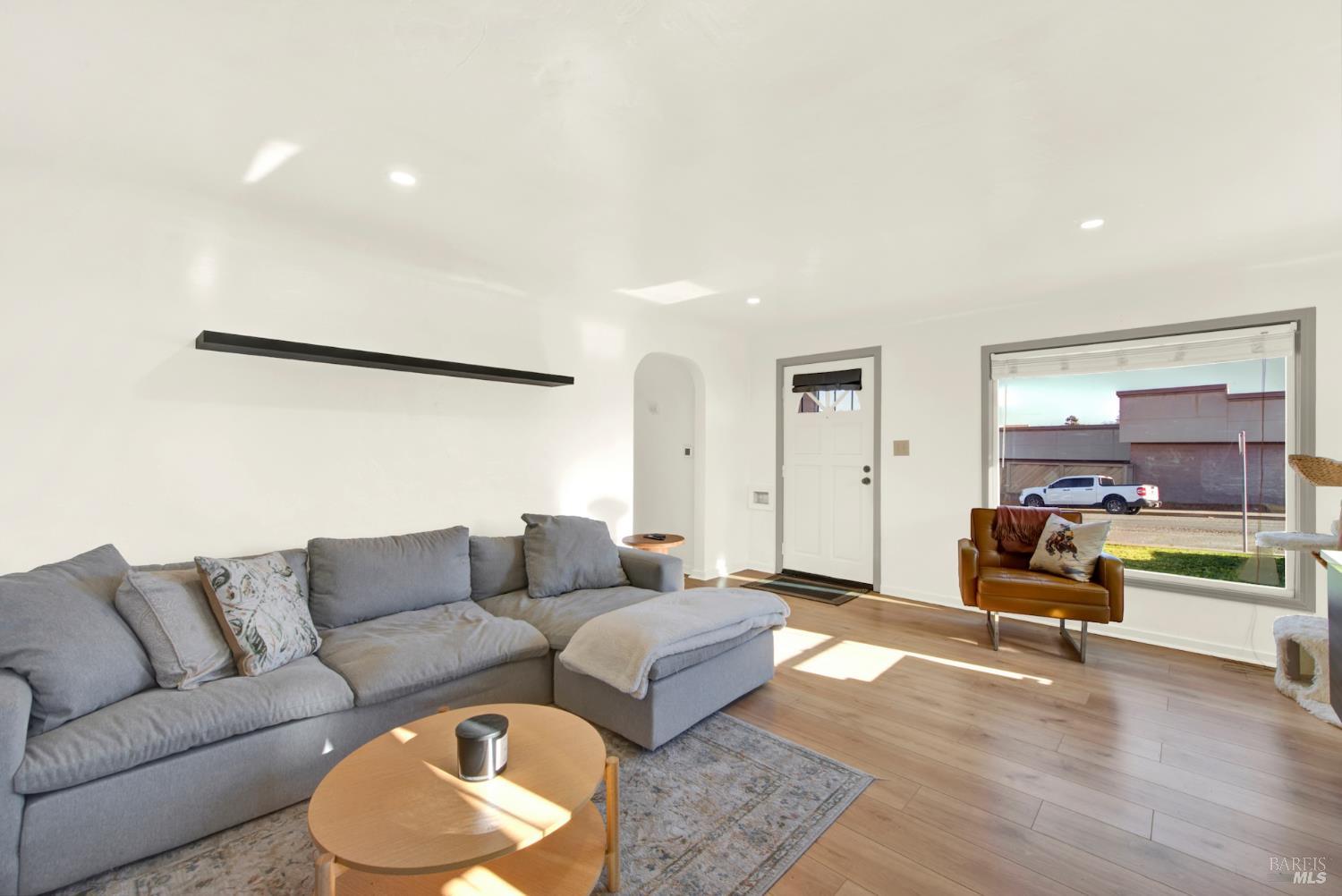 91 14th Street Vallejo, CA 94590 - Photo 10 of 48 a living room with furniture and a wooden floor