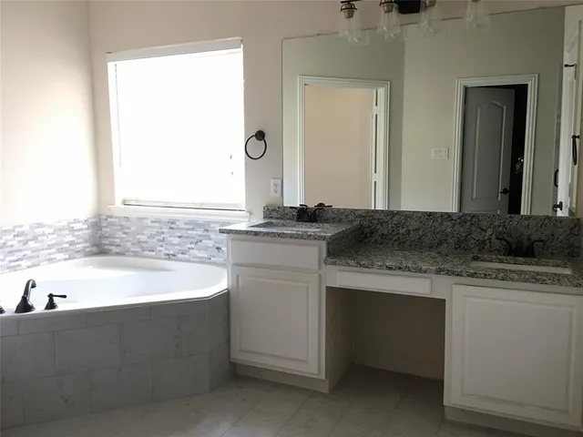 a bathroom with a sink and a bathtub