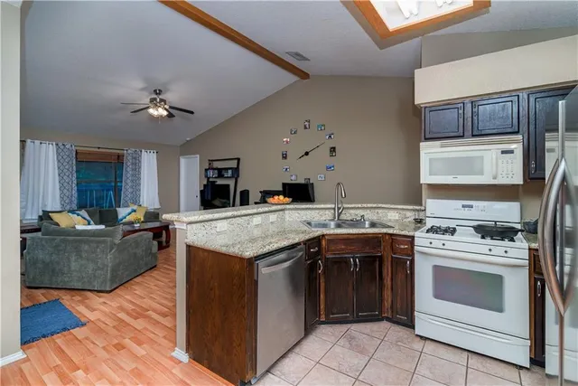 a view of a backyard with a deck and a slide