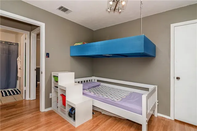 a view of a workspace with furniture and wooden floor