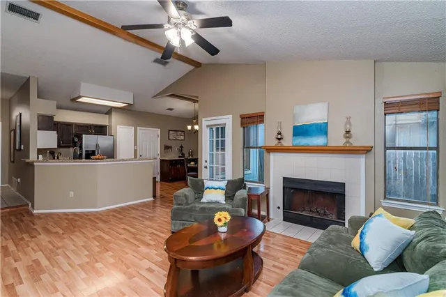 a living room with furniture and a fireplace
