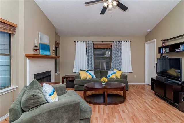 a living room with furniture and a fireplace