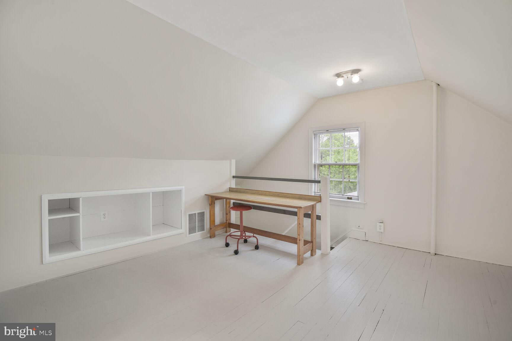 6011 Broad Branch Road Northwest Washington, DC 20015 - Photo 18 of 27 a room with wooden floor and furniture