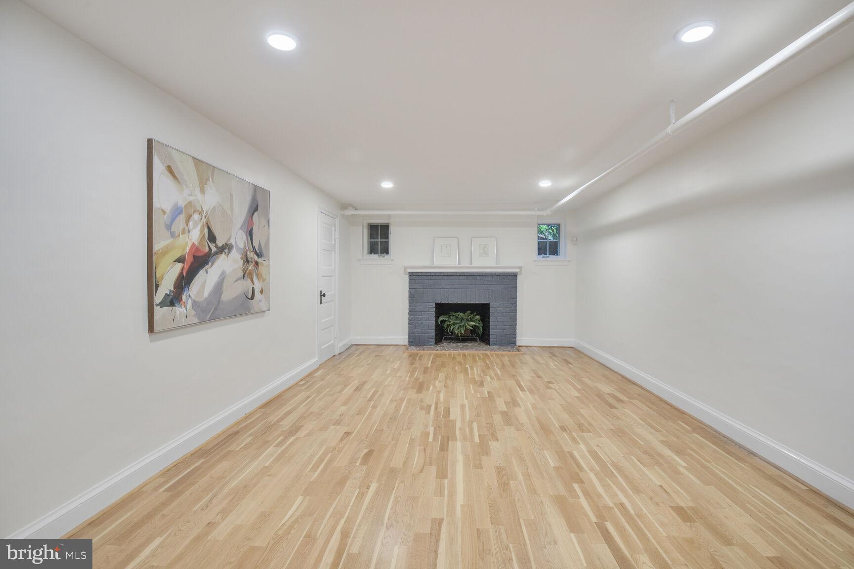 6011 Broad Branch Road Northwest Washington, DC 20015 - Photo 19 of 27 a view of an empty room with a fireplace