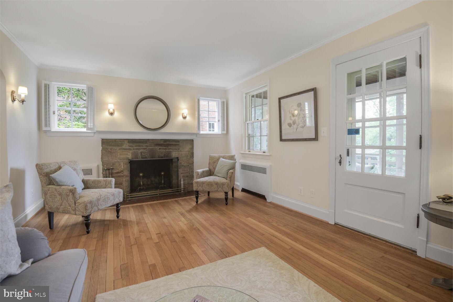 6011 Broad Branch Road Northwest Washington, DC 20015 - Photo 6 of 27 a living room with furniture and a fireplace