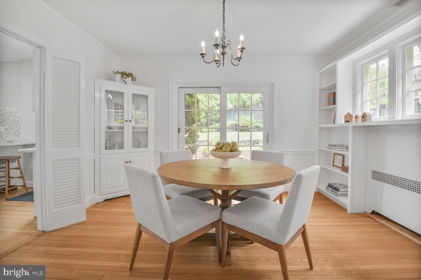 6011 Broad Branch Road Northwest Washington, DC 20015 - Photo 10 of 27 a view of a dining room with furniture window and wooden floor