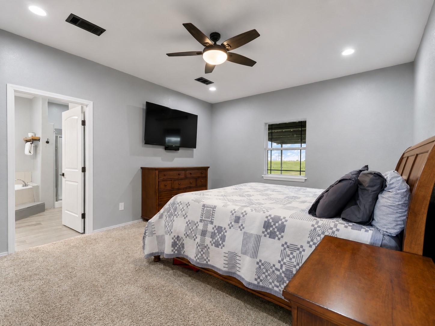 11301 South FM 441 Road El Campo, TX 77437 - Photo 11 of 32 Ample room for large scale furniture. A glimpse of the luxurious en-suite bath.