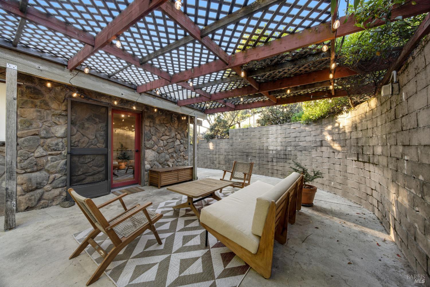 6960 Round Oak Road Penngrove, CA 94951 - Photo 43 of 58 a view of a patio with table and chairs and potted plants