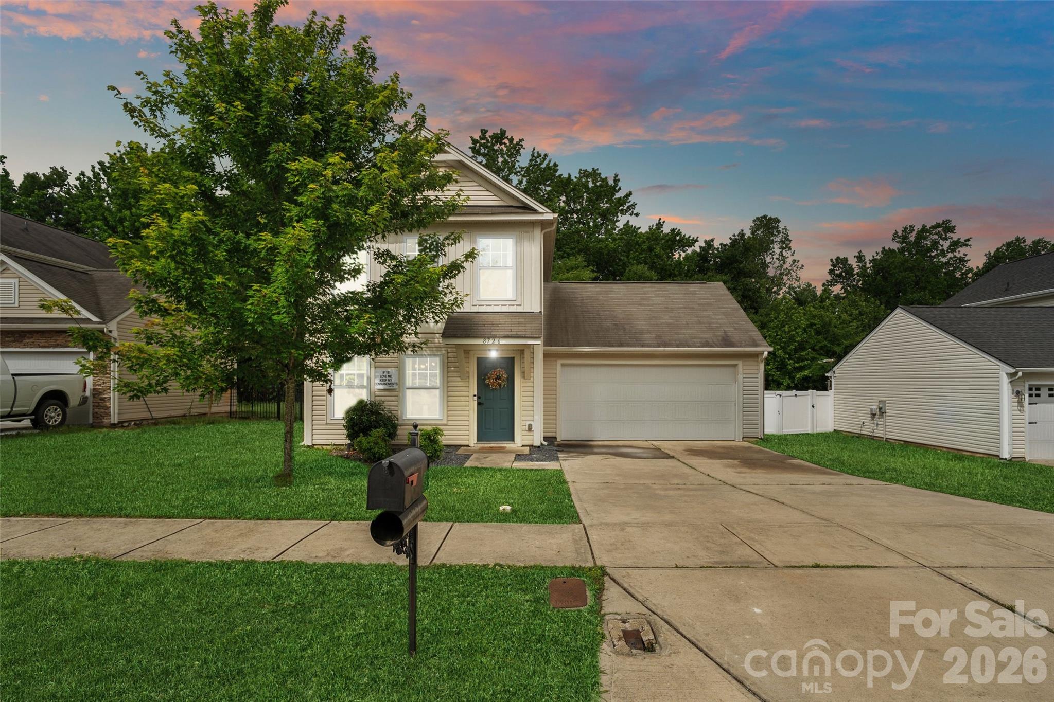 8726 Conrad Street Locust, NC 28097 - Photo 26 of 36 a front view of a house with garden