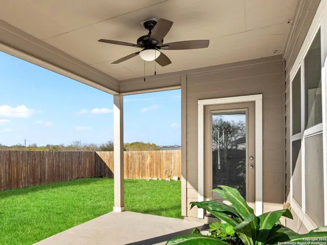 a view of a porch in front of a house with a yard