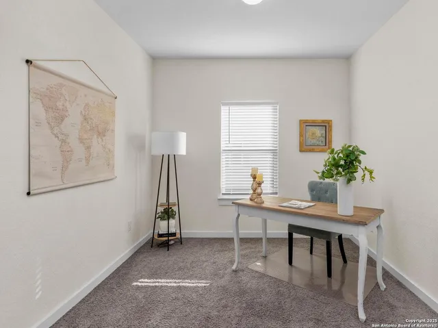 a view of a workspace with furniture