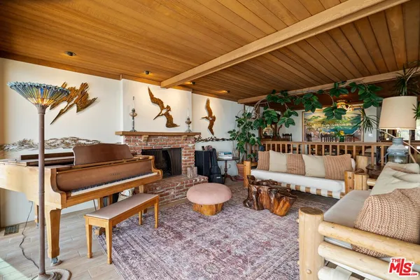 a view of a balcony with wooden floor and city view