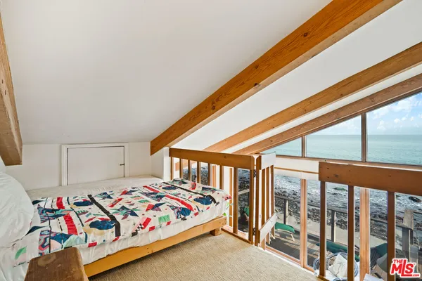a bedroom with a bed and a closet