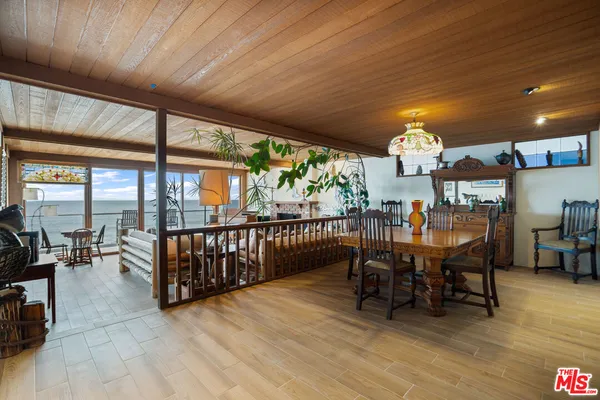 a view of a chairs and table in patio