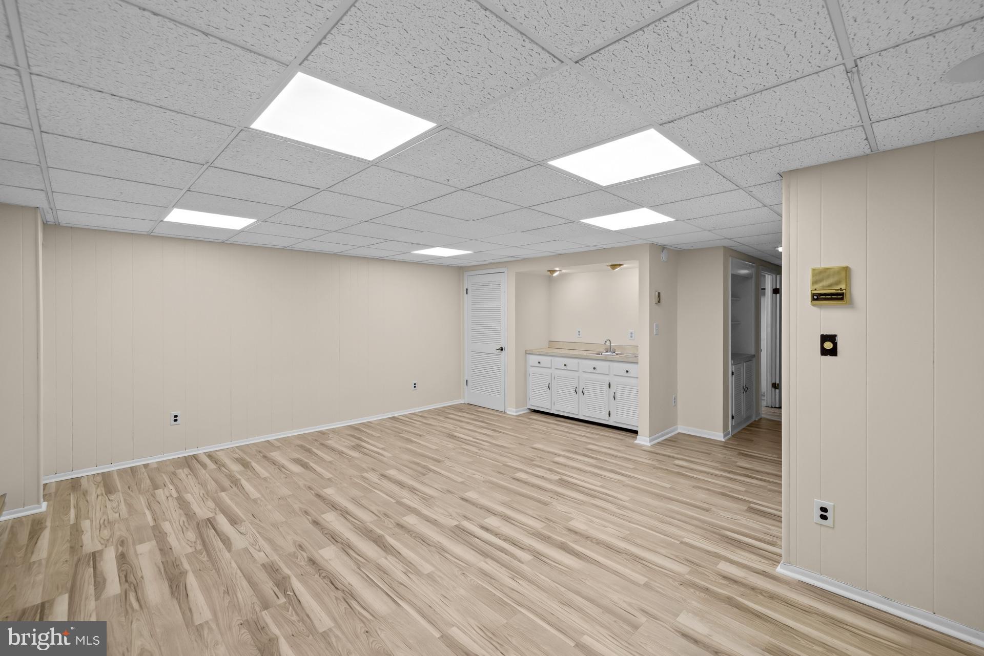 8493 Snowden Oaks Place Laurel, MD 20708 - Photo 32 of 42 Wet Bar and beautiful flooring throughout