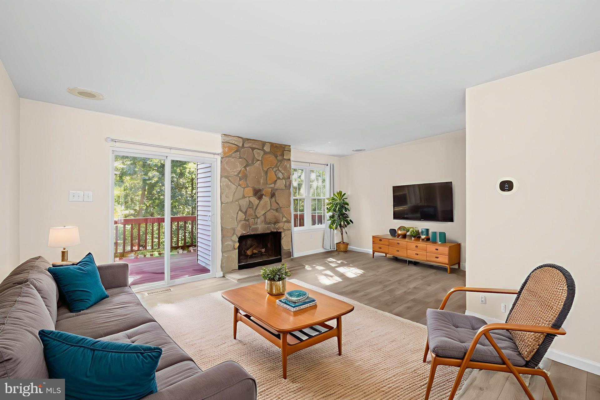 8493 Snowden Oaks Place Laurel, MD 20708 - Photo 10 of 42 Spacious Living Room with Stone Fireplace