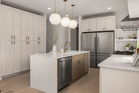 a stove top oven sitting inside of a kitchen