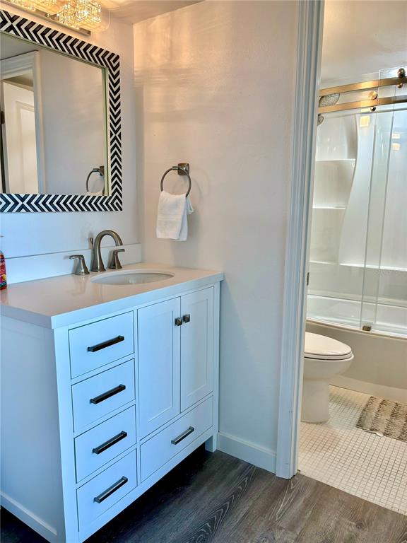 5855 Midnight Pass Road, Unit 621 Sarasota, FL 34242 - Photo 14 of 26 a bathroom with a sink and a mirror