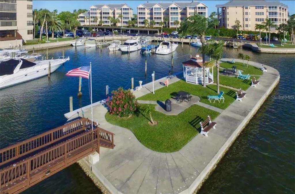 5855 Midnight Pass Road, Unit 621 Sarasota, FL 34242 - Photo 16 of 26 a view of a swimming pool with outdoor seating