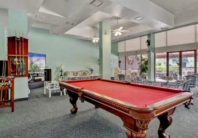 a kitchen with a sink a counter top space and stainless steel appliances