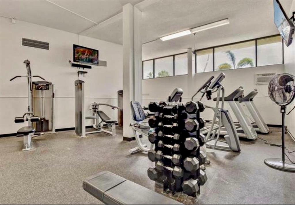 5855 Midnight Pass Road, Unit 621 Sarasota, FL 34242 - Photo 22 of 26 a view of a room with gym equipment