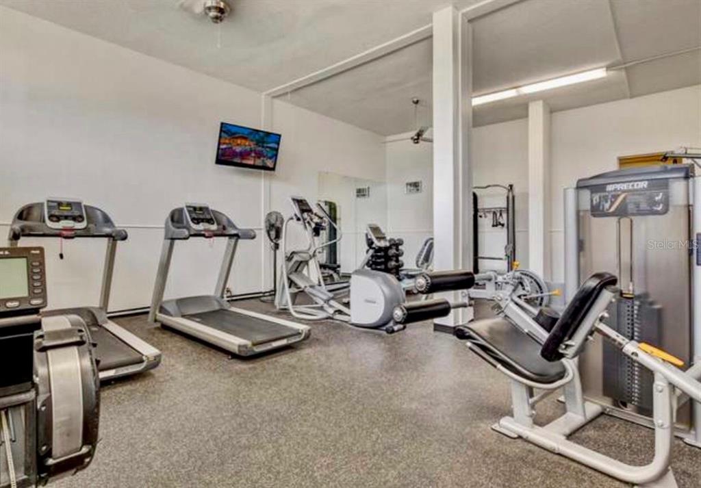 5855 Midnight Pass Road, Unit 621 Sarasota, FL 34242 - Photo 23 of 26 a view of a room with gym equipment