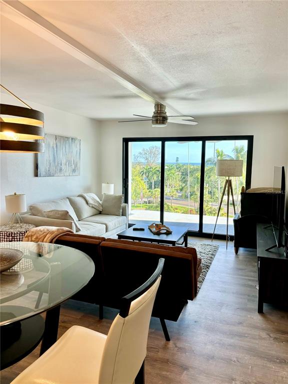 5855 Midnight Pass Road, Unit 621 Sarasota, FL 34242 - Photo 4 of 26 a dining room with a large window and table