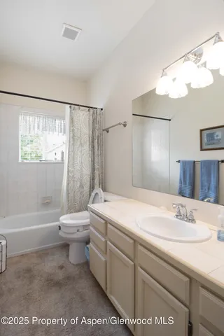 a room with furniture and a window