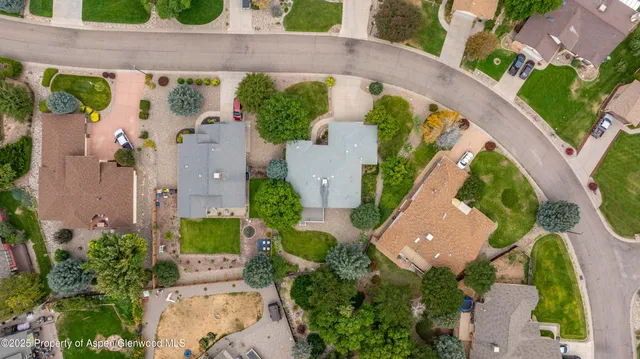 an aerial view of a house with a swimming pool