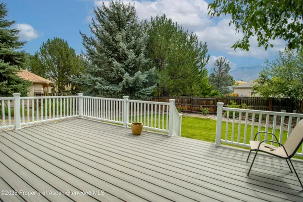a house view with a bench