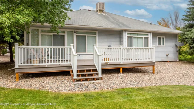 a view of a deck patio and outdoor seating